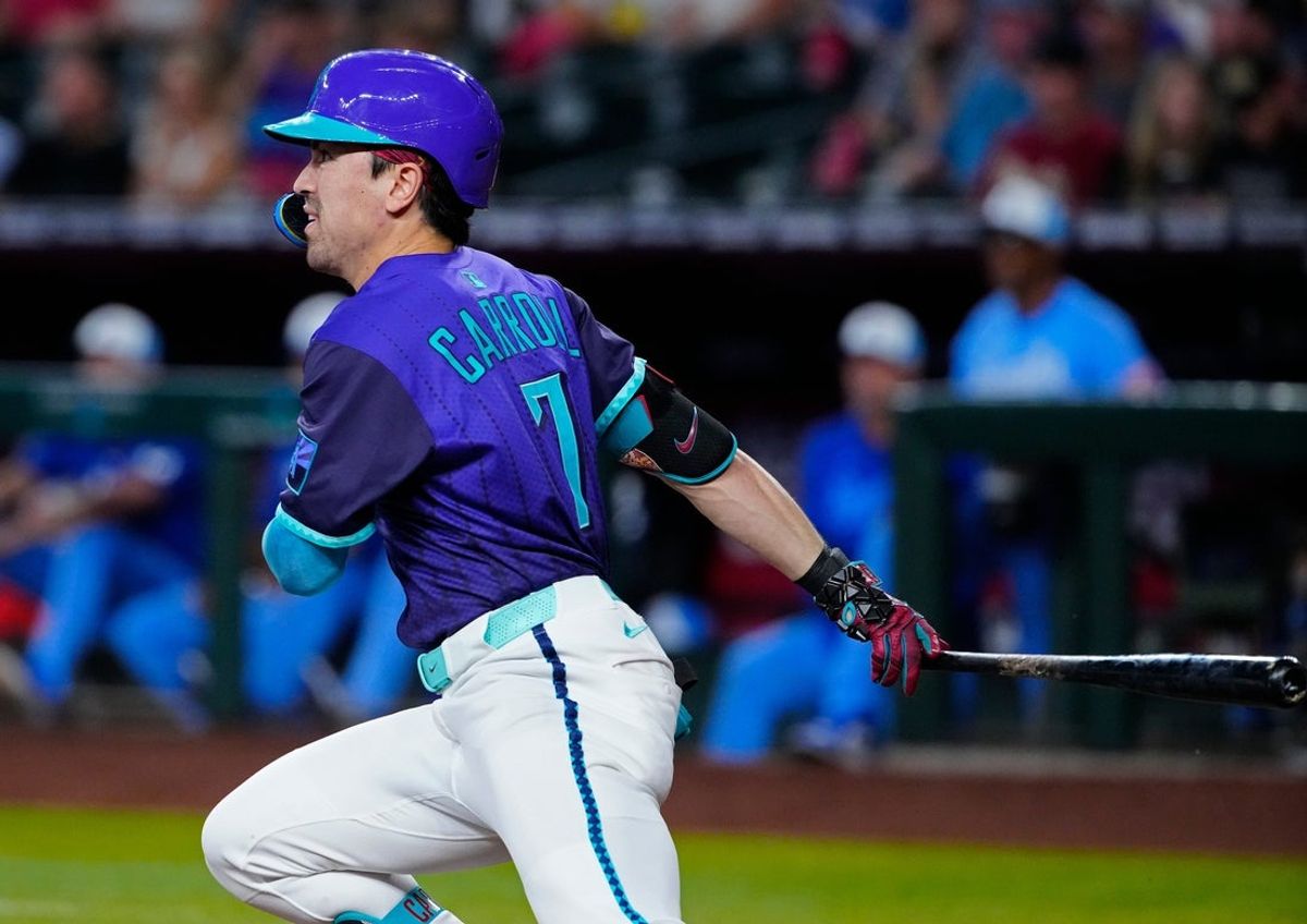 Diamondbacks outfielder Corbin Carroll (7) hits a ball in the third inning against the Royals during a game in Phoenix, at Chase Field on July 5, 2025.