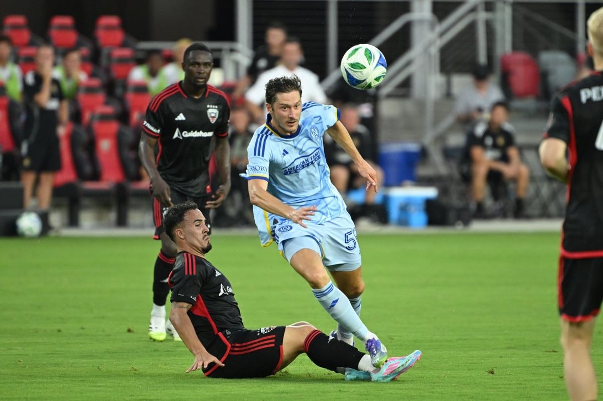 Jul 5, 2025; Washington, District of Columbia, USA; Atlanta United midfielder Aleksey Miranchuk (59) battles D.C. United forward João Peglow (7) for the ball during the first half at Audi Field. Mandatory Credit: Rafael Suanes-Imagn Images