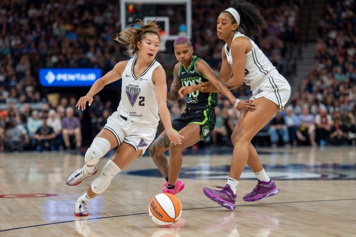 Jul 5, 2025; Minneapolis, Minnesota, USA; Golden State Valkyries guard Kaitlyn Chen (2) dribbles past the defense of Minnesota Lynx guard Courtney Williams (10) in the first quarter at Target Center. Mandatory Credit: Matt Blewett-Imagn Images