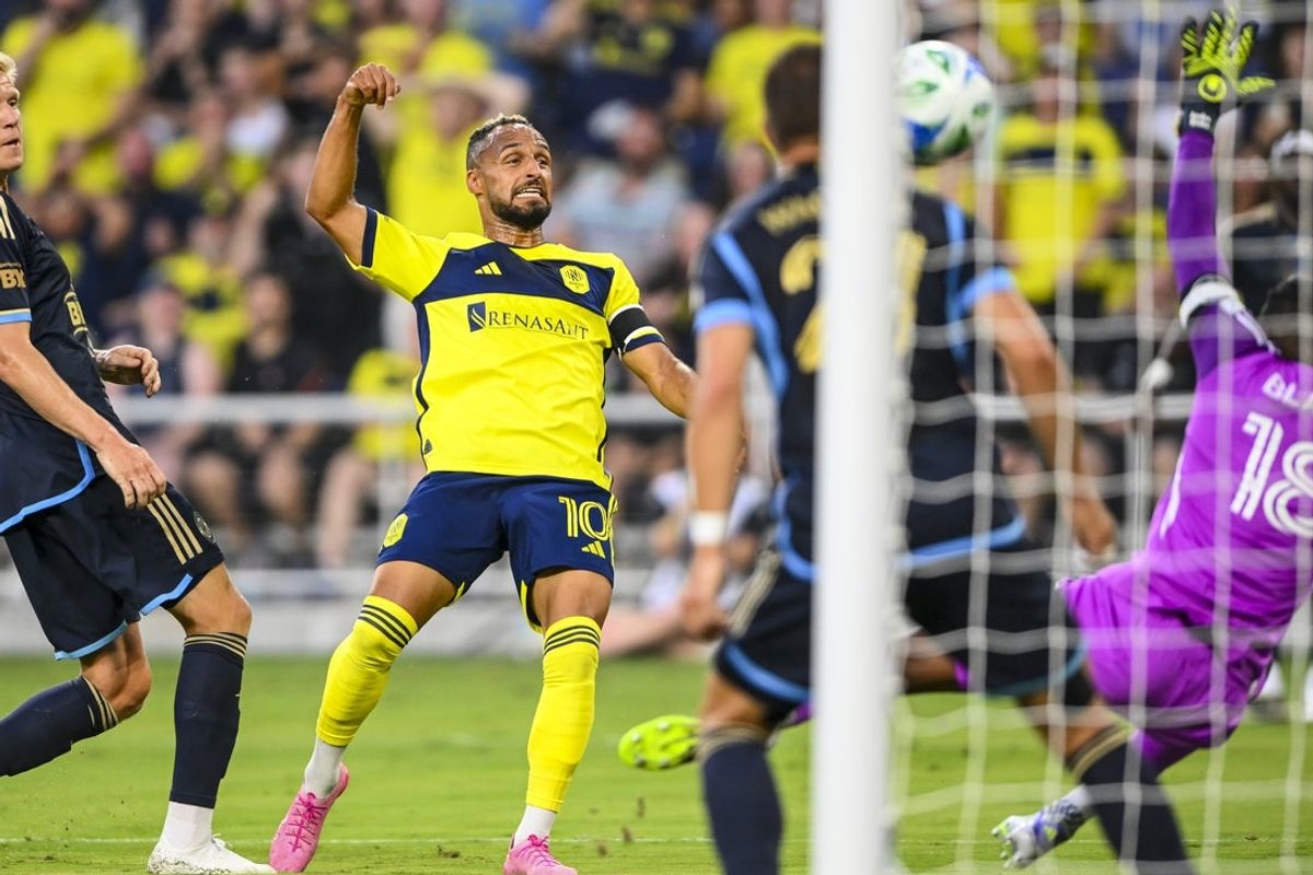 Jul 5, 2025; Nashville, Tennessee, USA;  Nashville SC midfielder Hany Mukhtar (10) takes a shot on goal against the Philadelphia Union during the first half at Geodis Park. Mandatory Credit: Steve Roberts-Imagn Images