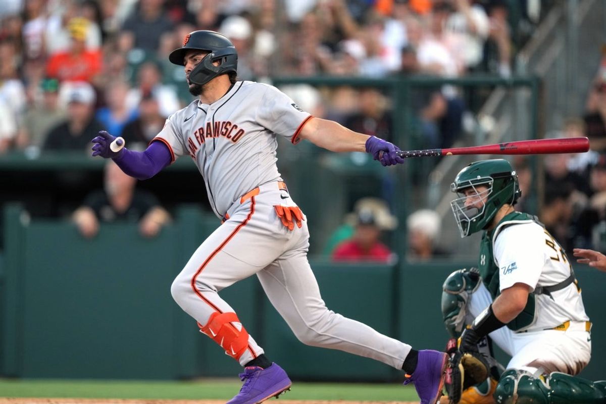 Jul 5, 2025; West Sacramento, California, USA; San Francisco Giants shortstop Willy Adames (2) hits an RBI single against the Athletics during the third inning at Sutter Health Park. Mandatory Credit: Darren Yamashita-Imagn Images