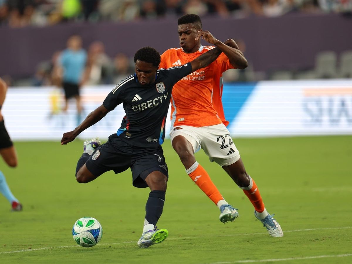 Jul 5, 2025; San Diego, California, USA; San Diego FC forward Marcus Ingvartsen (7) kicks the ball against Houston Dynamo defender Pablo Ortiz (22) during the first half at Snapdragon Stadium. Mandatory Credit: Abe Arredondo-Imagn Images