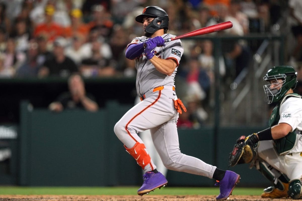 Jul 5, 2025; West Sacramento, California, USA; San Francisco Giants shortstop Willy Adames (2) hits a single against the Athletics during the seventh inning at Sutter Health Park. Mandatory Credit: Darren Yamashita-Imagn Images