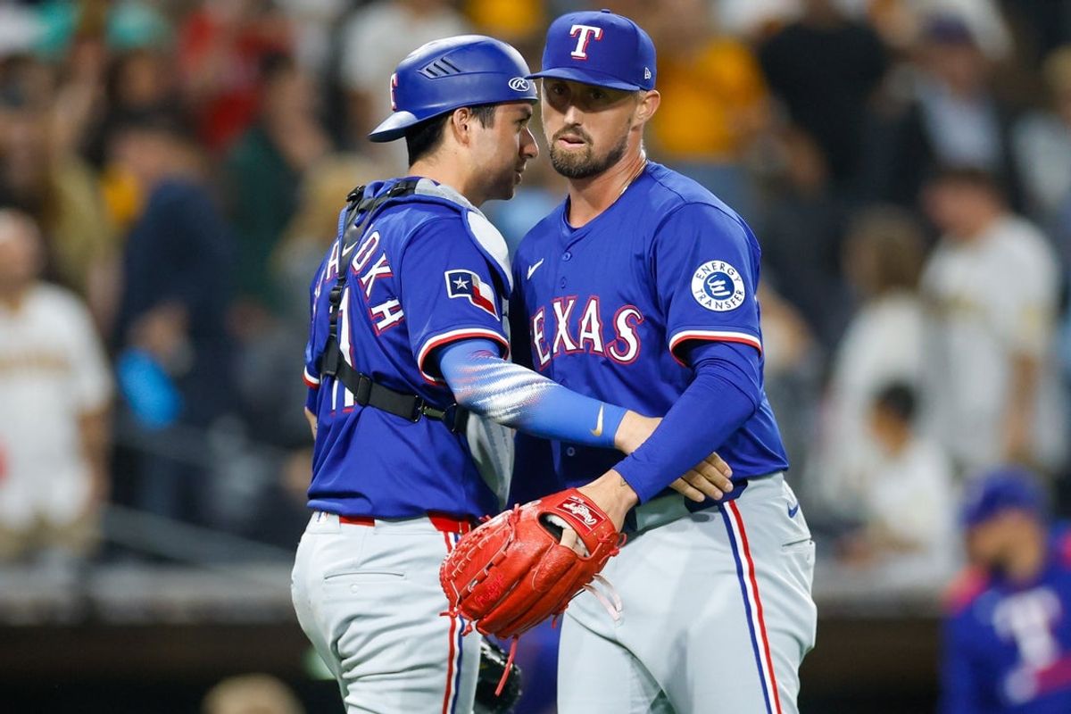 Jul 5, 2025; San Diego, California, USA; Texas Rangers relief pitcher Shawn Armstrong (43) celebrates with catcher Kyle Higashioka (11) after defeating the San Diego Padres  at Petco Park. Mandatory Credit: David Frerker-Imagn Images