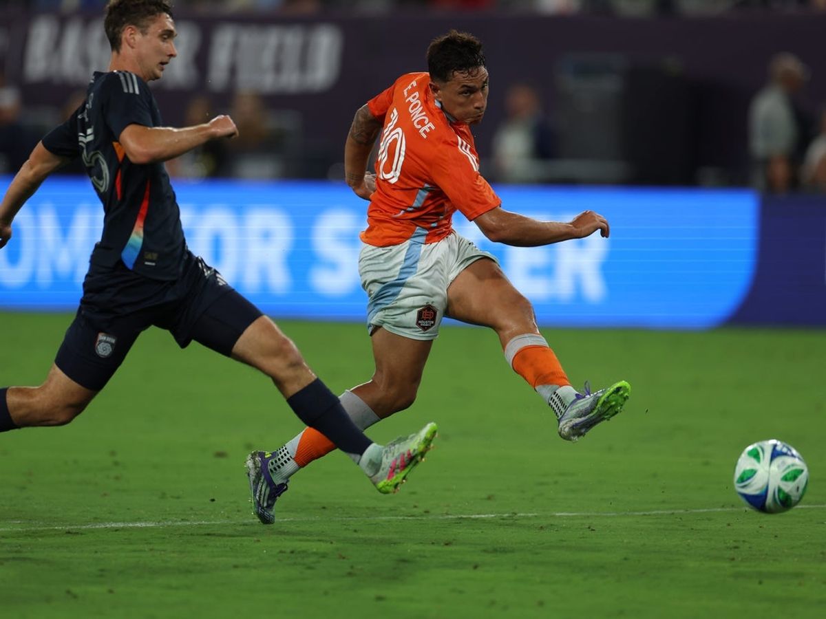 Jul 5, 2025; San Diego, California, USA; Houston Dynamo forward Ezequiel Ponce (10) scores a goal against San Diego FC defender Ian Pilcher (25) during the second half at Snapdragon Stadium. Mandatory Credit: Abe Arredondo-Imagn Images
