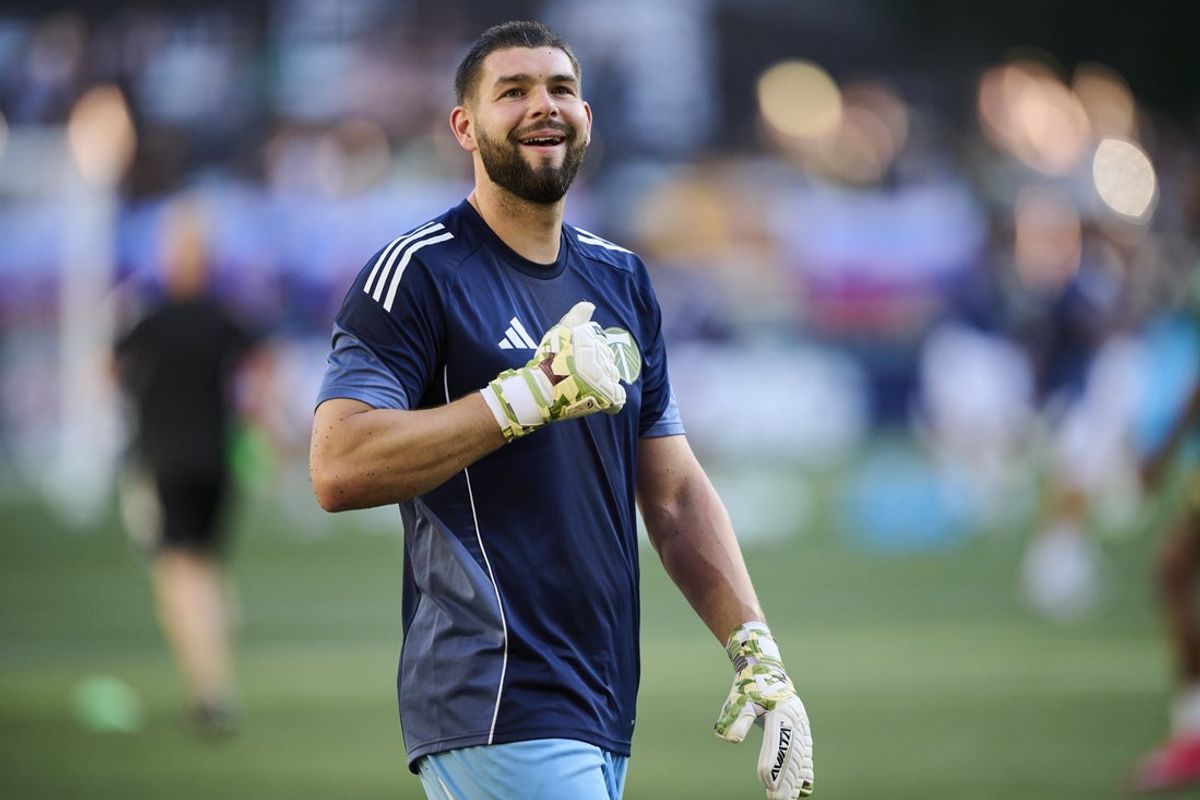 Jul 5, 2025; Portland, Oregon, USA; Portland Timbers goalkeeper Maxime Crepeau (16) smiles at fans during warms ups before a game against the New England Revolution at Providence Park. Mandatory Credit: Troy Wayrynen-Imagn Images
