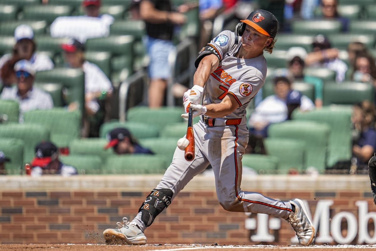 Jul 6, 2025; Cumberland, Georgia, USA; Baltimore Orioles second baseman Jackson Holliday (7) hits a two run home run against the Atlanta Braves during the third inning at Truist Park. Mandatory Credit: Dale Zanine-Imagn Images