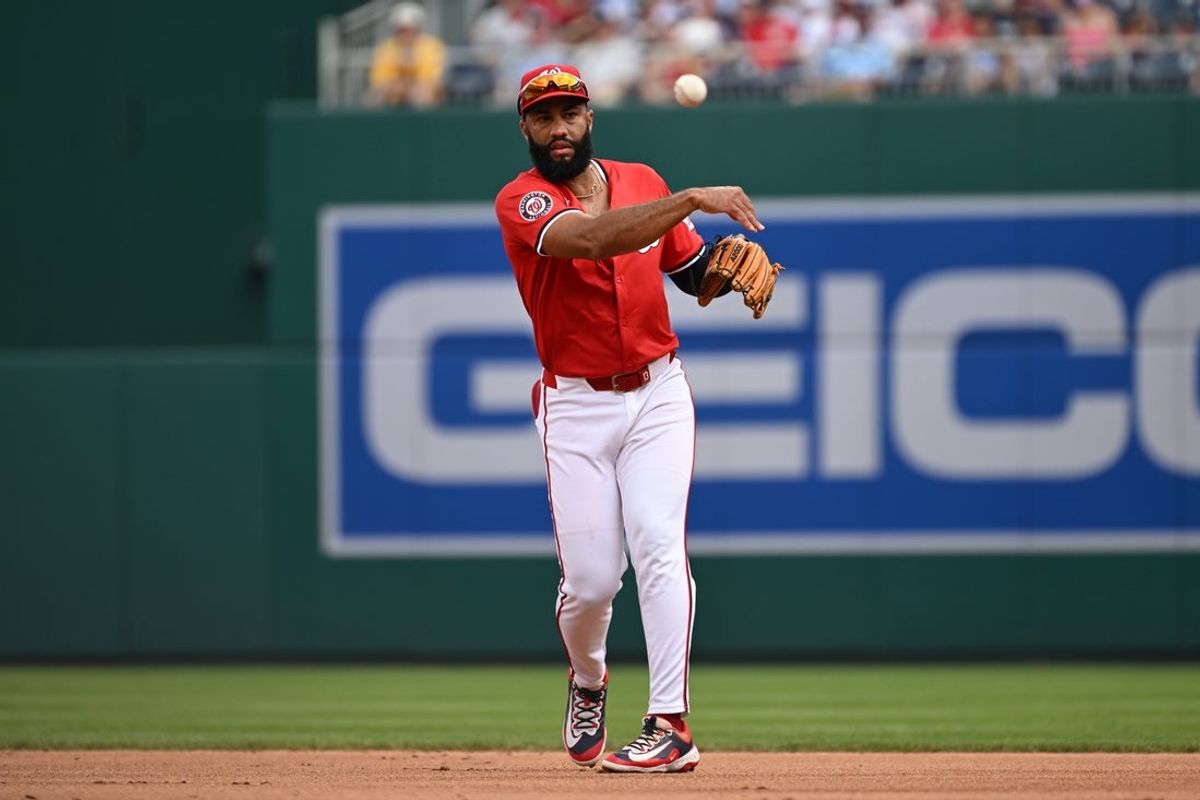 Jul 6, 2025; Washington, District of Columbia, USA; Washington Nationals third baseman Amed Rosario (13) attempts a throw to first base against the Boston Red Sox during the first inning at Nationals Park. Mandatory Credit: Rafael Suanes-Imagn Images