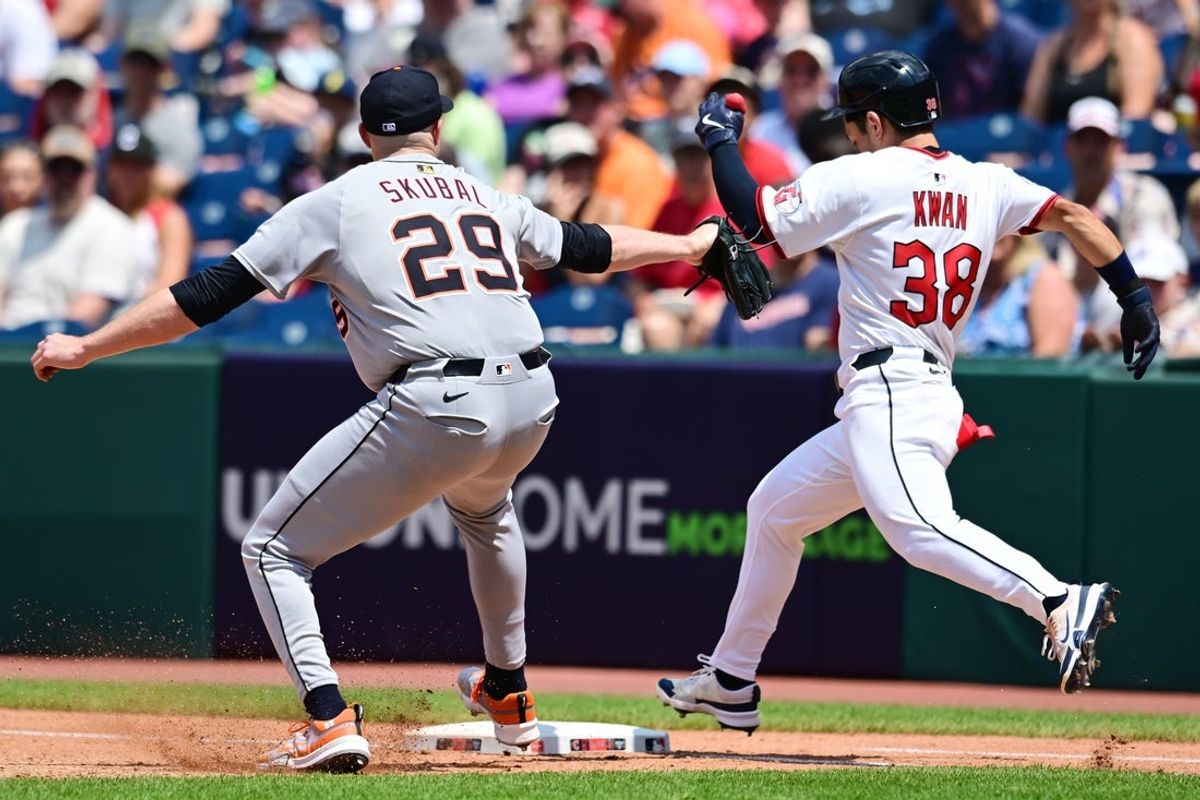 Jul 6, 2025; Cleveland, Ohio, USA; Cleveland Guardians left fielder Steven Kwan (38) beats Detroit Tigers starting pitcher Tarik Skubal (29) to first base for a it during the fourth inning at Progressive Field. Mandatory Credit: Ken Blaze-Imagn Images