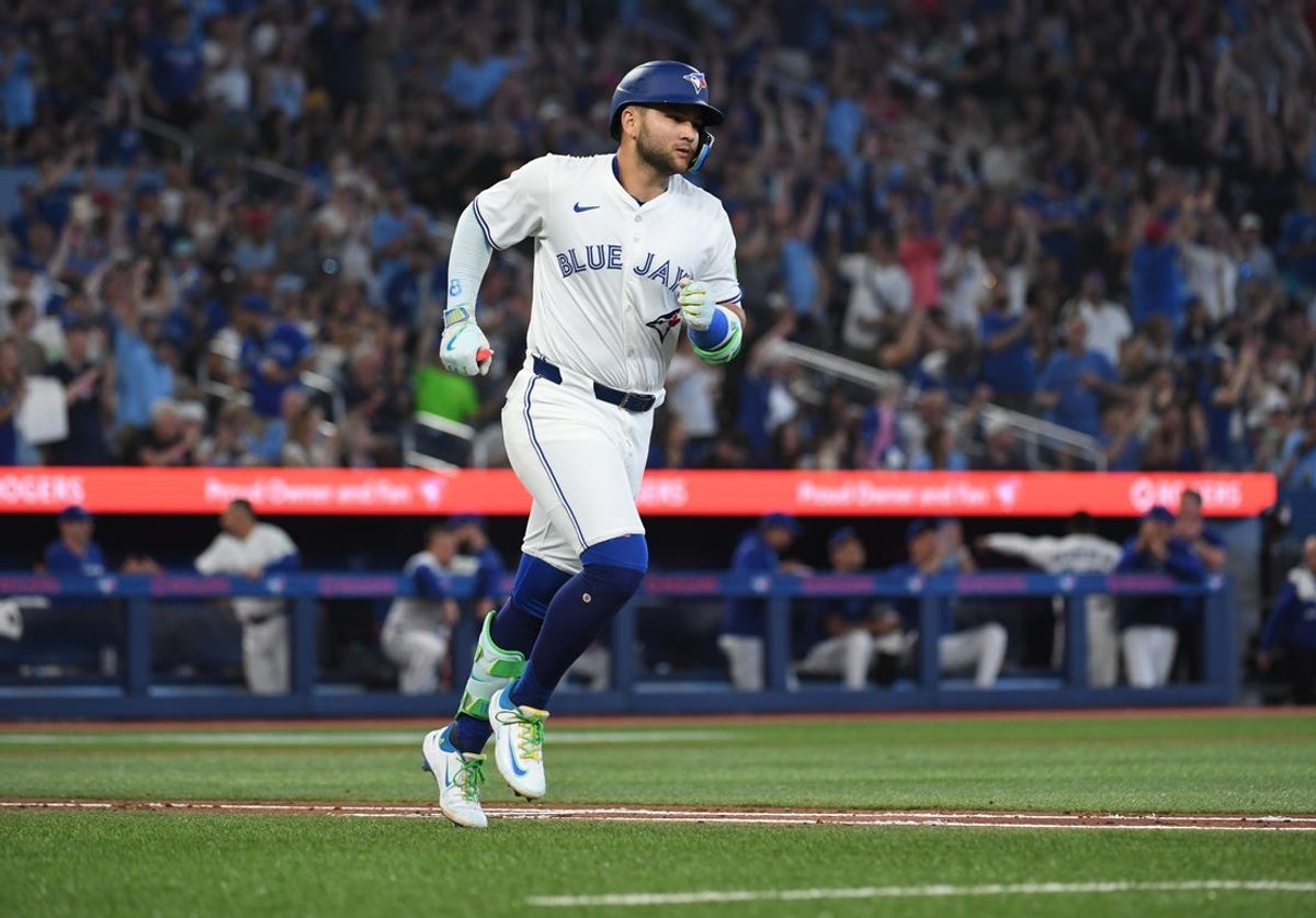 Jul 6, 2025; Toronto, Ontario, CAN;  Toronto Blue Jays shortstop Bo Bichette (11) runs the bases after hitting a solo home run against the Los Angeles Angels in the fourth inning at Rogers Centre. Mandatory Credit: Dan Hamilton-Imagn Images