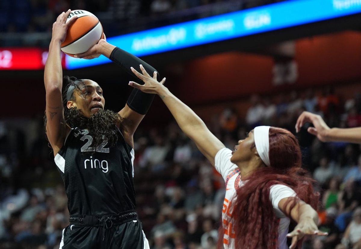 Jul 6, 2025; Uncasville, Connecticut, USA; Las Vegas Aces center A'ja Wilson (22) shoots against Connecticut Sun forward Aneesah Morrow (24) in the first half at Mohegan Sun Arena. Mandatory Credit: David Butler II-Imagn Images