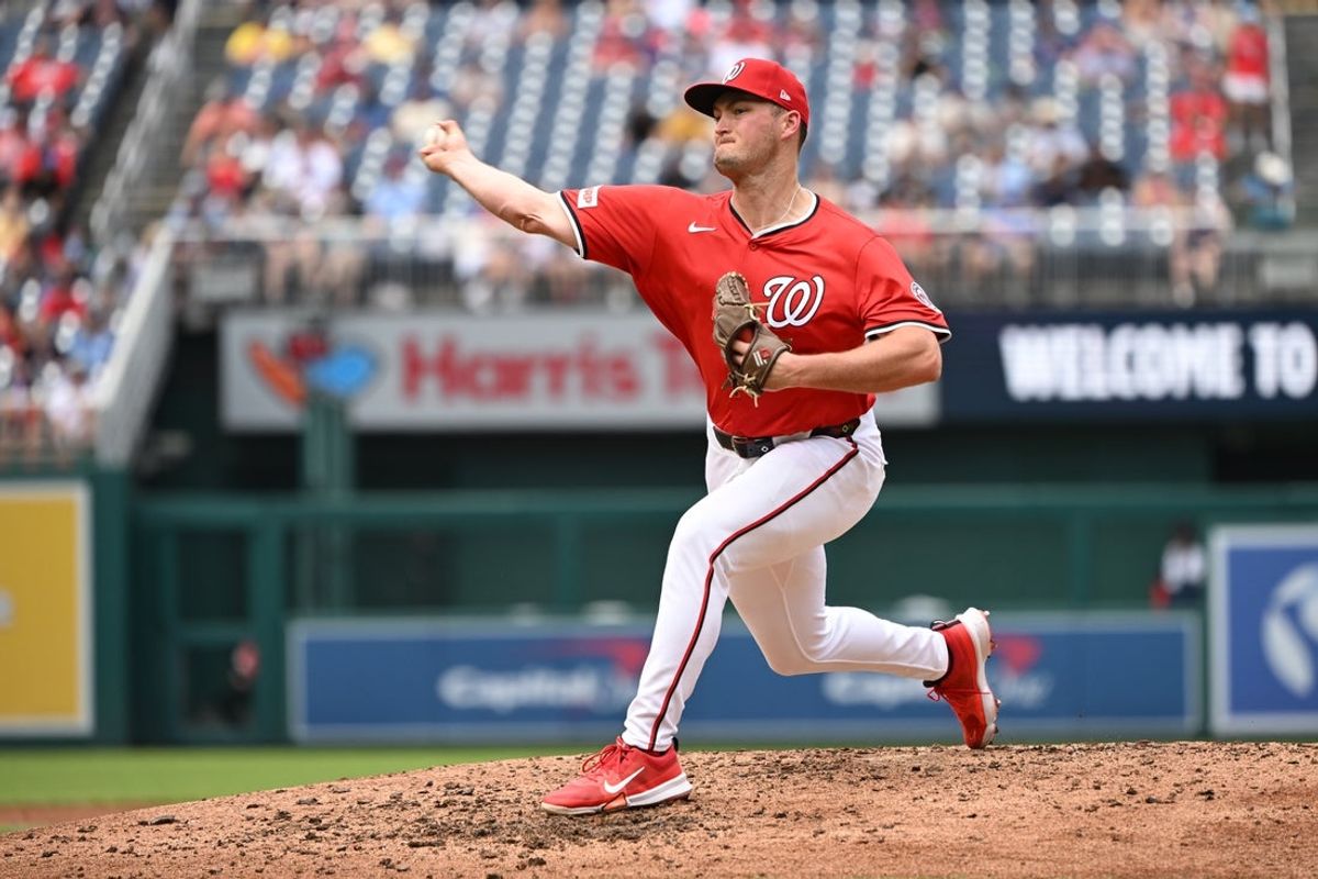 Jul 6, 2025; Washington, District of Columbia, USA; Washington Nationals relief pitcher Brad Lord (61) throws a pitch against the Boston Red Sox during the fifth inning at Nationals Park. Mandatory Credit: Rafael Suanes-Imagn Images