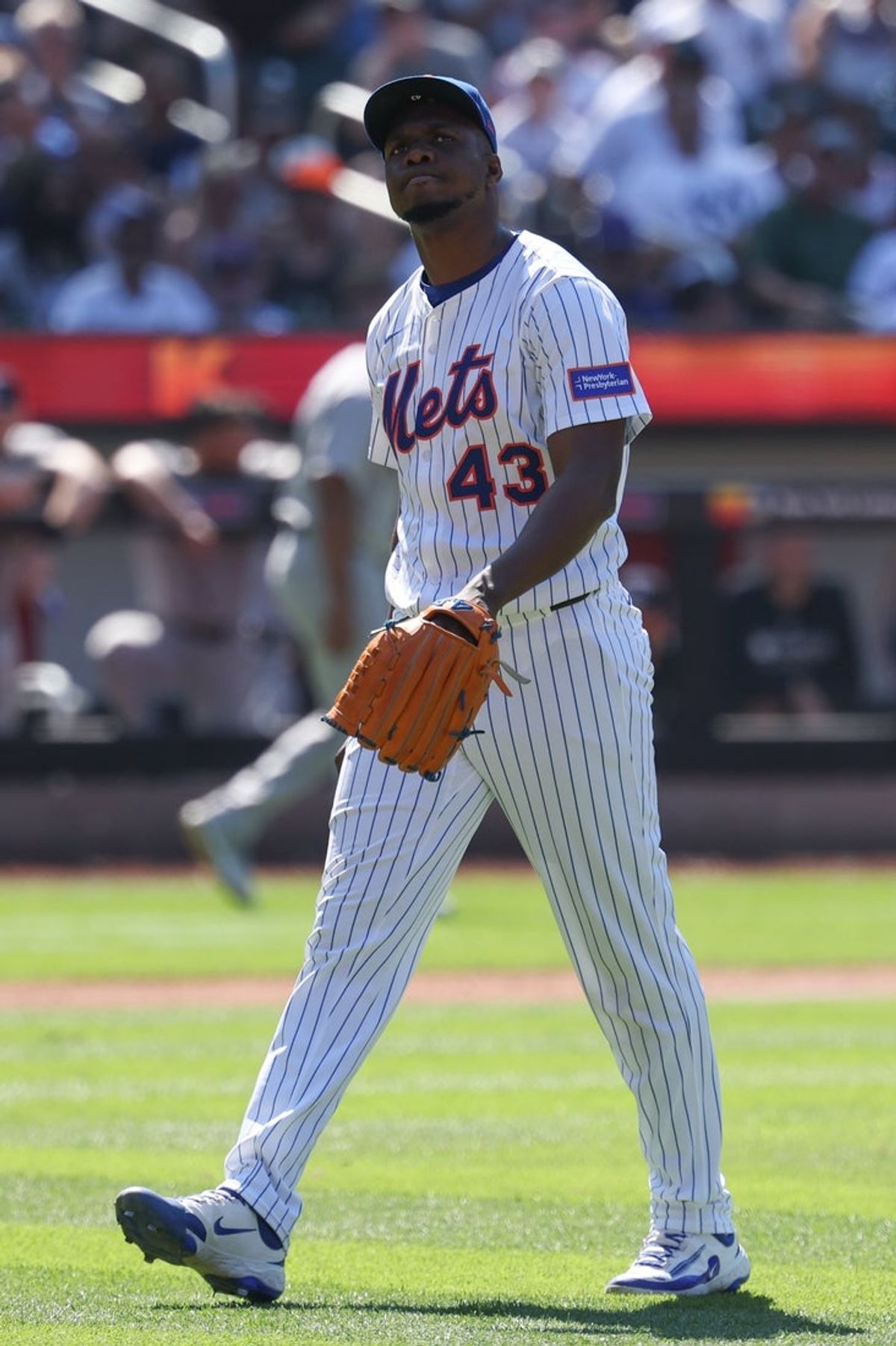 Jul 6, 2025; New York City, New York, USA; New York Mets relief pitcher Huascar Brazoban (43) walks off  the field after the top of the seventh inning against the New York Yankees at Citi Field. Mandatory Credit: Vincent Carchietta-Imagn Images