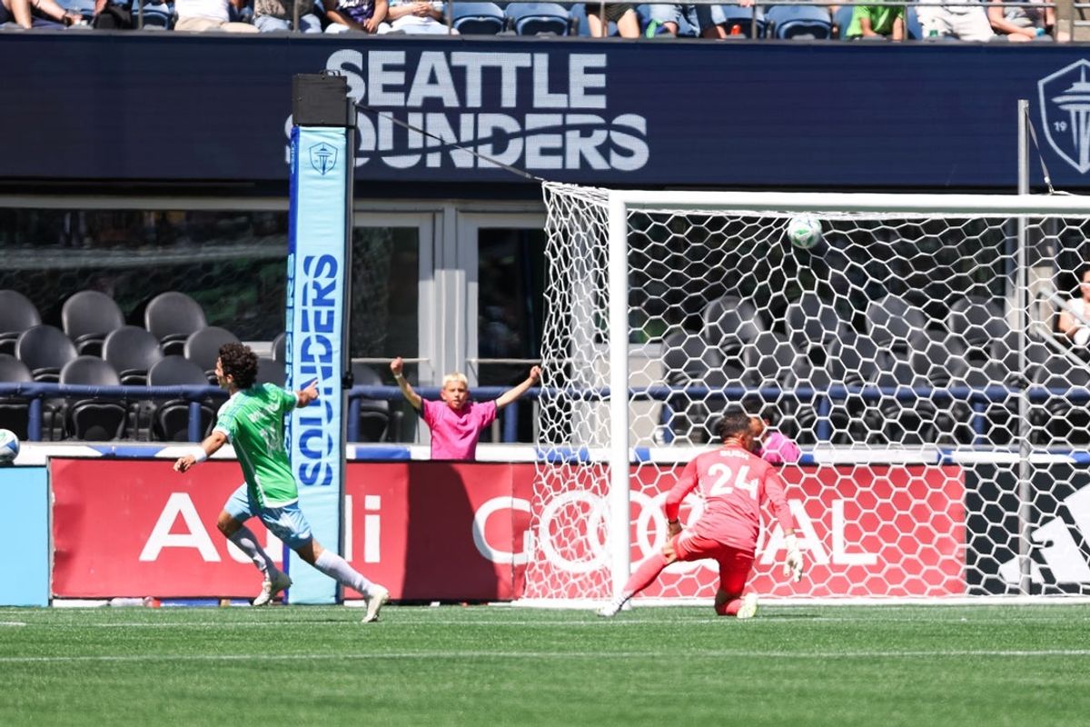 Jul 6, 2025; Seattle, Washington, USA; Seattle Sounders FC forward Paul Rothrock (14) scores against Columbus Crew during the first half at Lumen Field. Mandatory Credit: Kevin Ng-Imagn Images