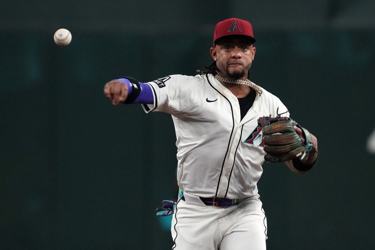 Jul 6, 2025; Phoenix, Arizona, USA; Arizona Diamondbacks second base Ketel Marte (4) makes the play for an out against the Kansas City Royals in the eighth inning at Chase Field. Mandatory Credit: Rick Scuteri-Imagn Images