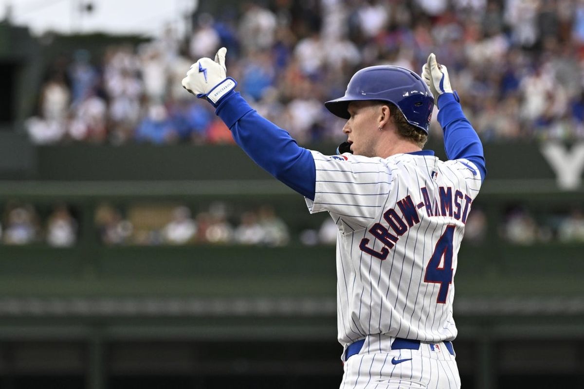 Jul 6, 2025; Chicago, Illinois, USA;  Chicago Cubs outfielder Pete Crow-Armstrong (4) signals a thumbs up after hitting an RBI single against the St. Louis Cardinals during the first inning at Wrigley Field. Mandatory Credit: Matt Marton-Imagn Images