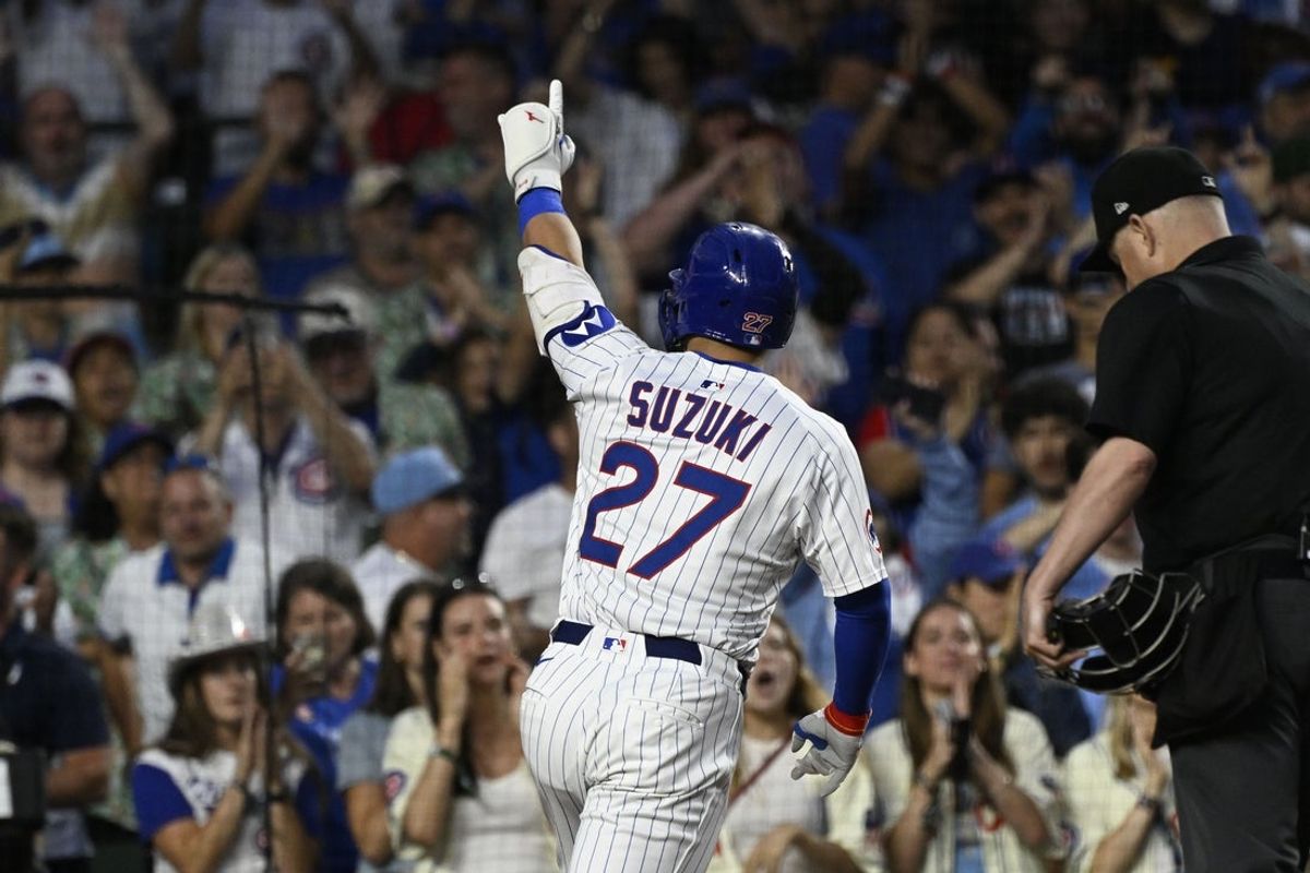 Jul 6, 2025; Chicago, Illinois, USA;  Chicago Cubs outfielder Seiya Suzuki (27) points after hitting a home run against the St. Louis Cardinals during the fifth inning at Wrigley Field. Mandatory Credit: Matt Marton-Imagn Images
