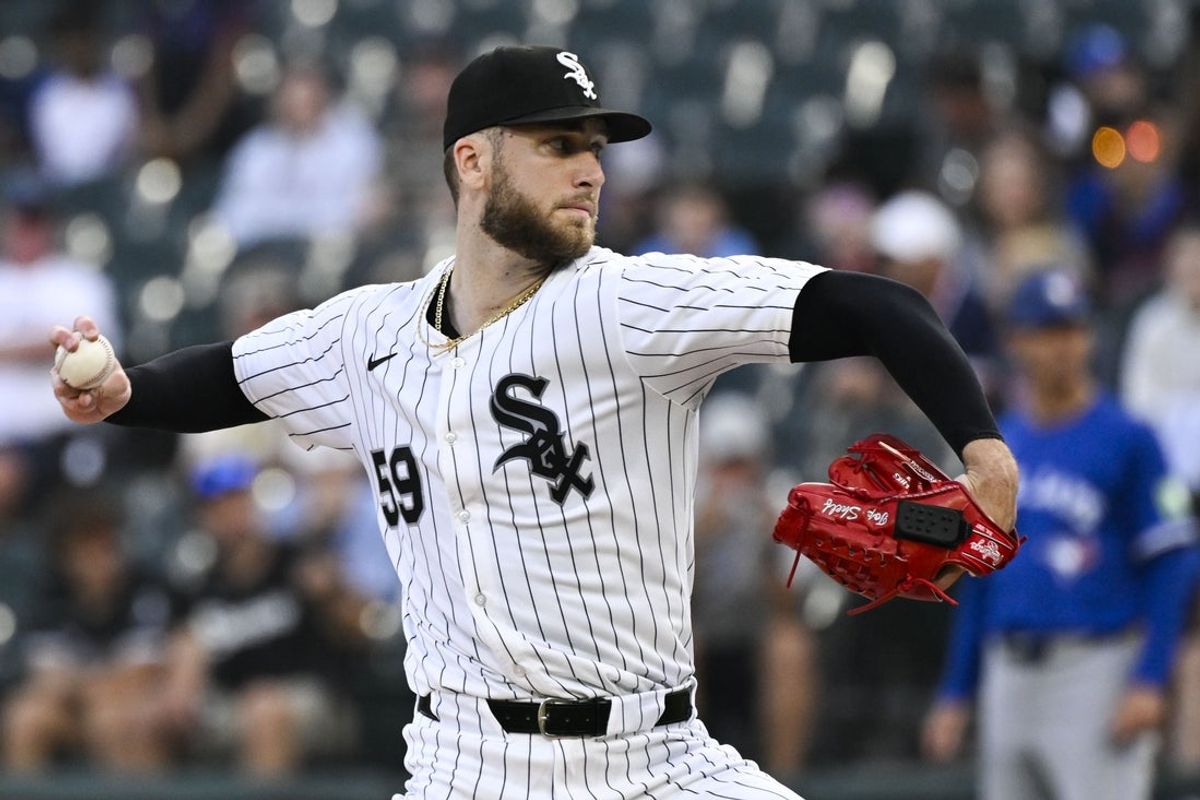 Jul 7, 2025; Chicago, Illinois, USA;  Chicago White Sox pitcher Sean Burke (59) delivers during the first inning against the Toronto Blue Jays at Rate Field. Mandatory Credit: Matt Marton-Imagn Images