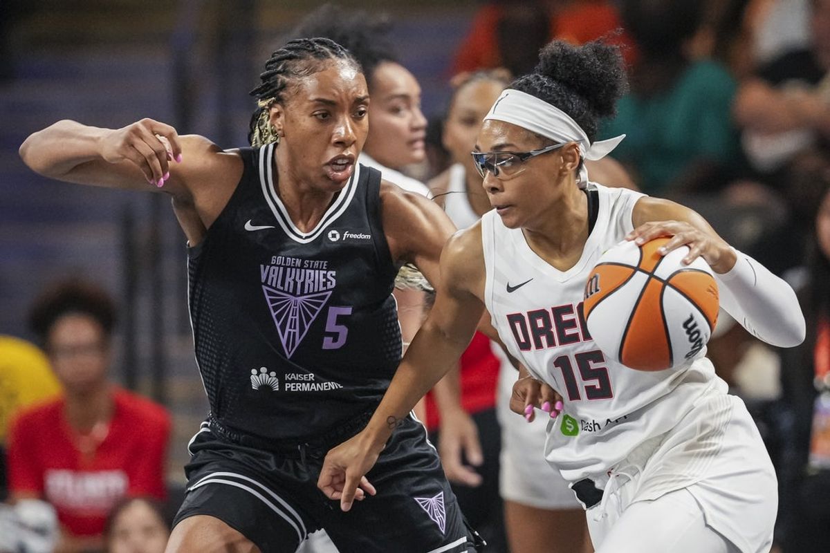 Jul 7, 2025; College Park, Georgia, USA; Atlanta Dream guard Allisha Gray (15) dribbles against Golden State Valkyries forward Kayla Thornton (5) during the first half at Gateway Center Arena at College Park. Mandatory Credit: Dale Zanine-Imagn Images
