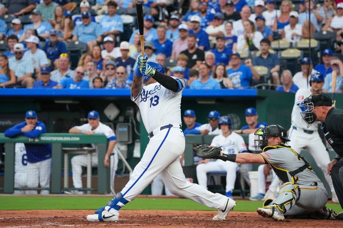 Jul 7, 2025; Kansas City, Missouri, USA; Kansas City Royals catcher Salvador Perez (13) hits a one run double against the Pittsburgh Pirates during the third inning at Kauffman Stadium. Mandatory Credit: Denny Medley-Imagn Images