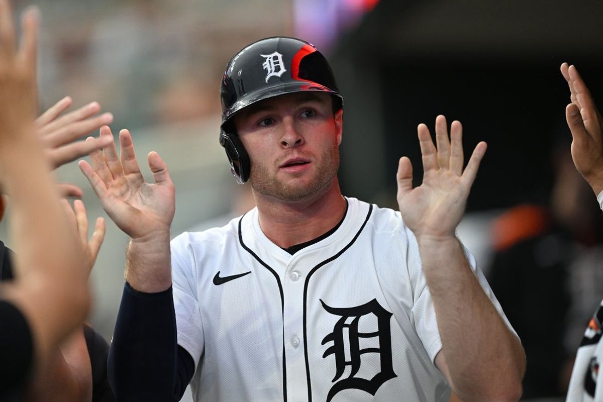 Jul 7, 2025; Detroit, Michigan, USA; Detroit Tigers designated hitter Colt Keith (33) celebrates in the dugout after scoring a run against the Tampa Bay Rays in the fifth inning at Comerica Park. Mandatory Credit: Lon Horwedel-Imagn Images