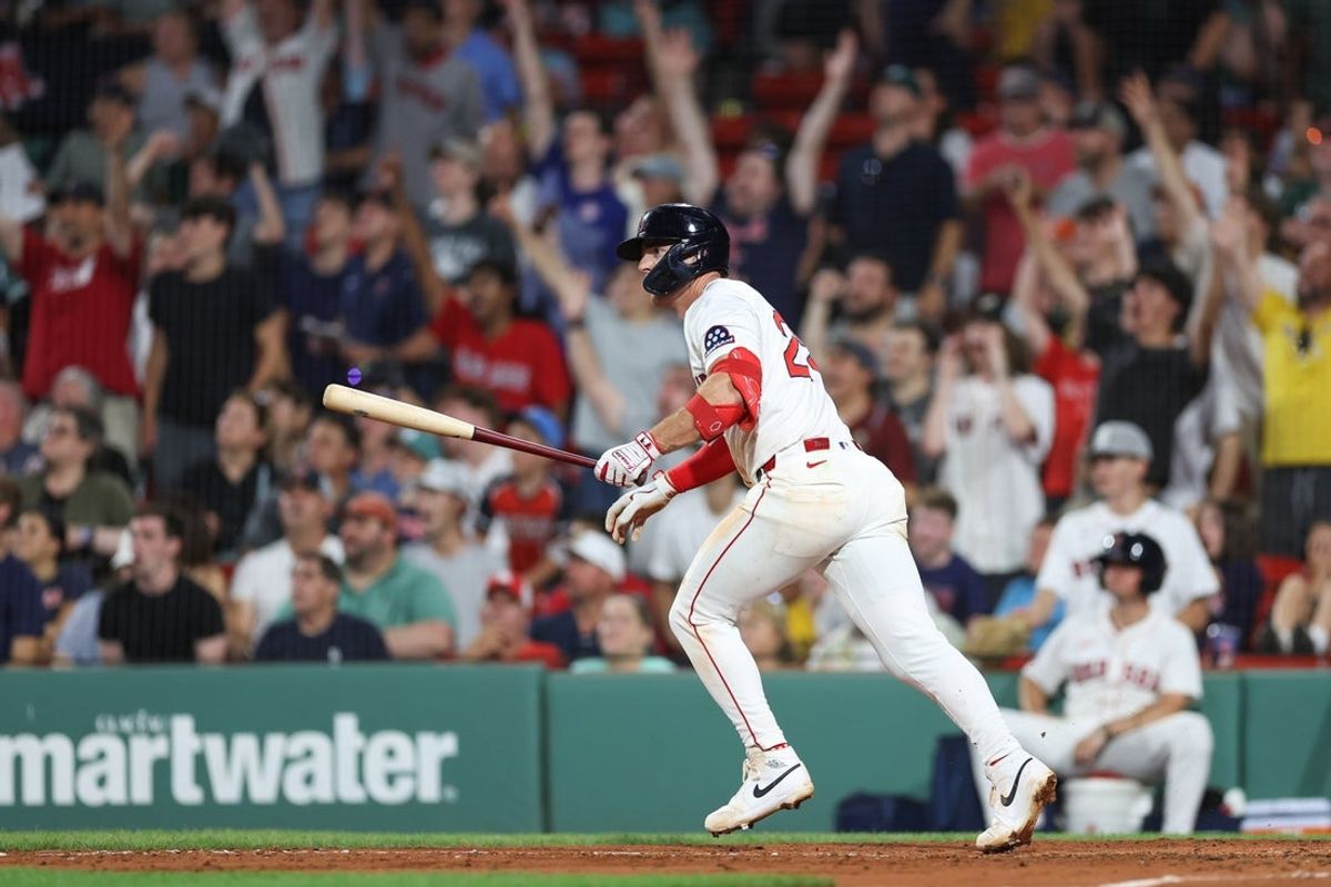 Jul 7, 2025; Boston, Massachusetts, USA; Boston Red Sox second baseman Romy Gonzalez (23) hits a solo home run during the eighth inning against the Colorado Rockies at Fenway Park. Mandatory Credit: Paul Rutherford-Imagn Images