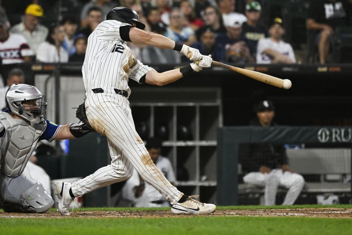Jul 7, 2025; Chicago, Illinois, USA;  Chicago White Sox shortstop Colson Montgomery (12) singles against the Toronto Blue Jays during the seventh inning at Rate Field. Mandatory Credit: Matt Marton-Imagn Images