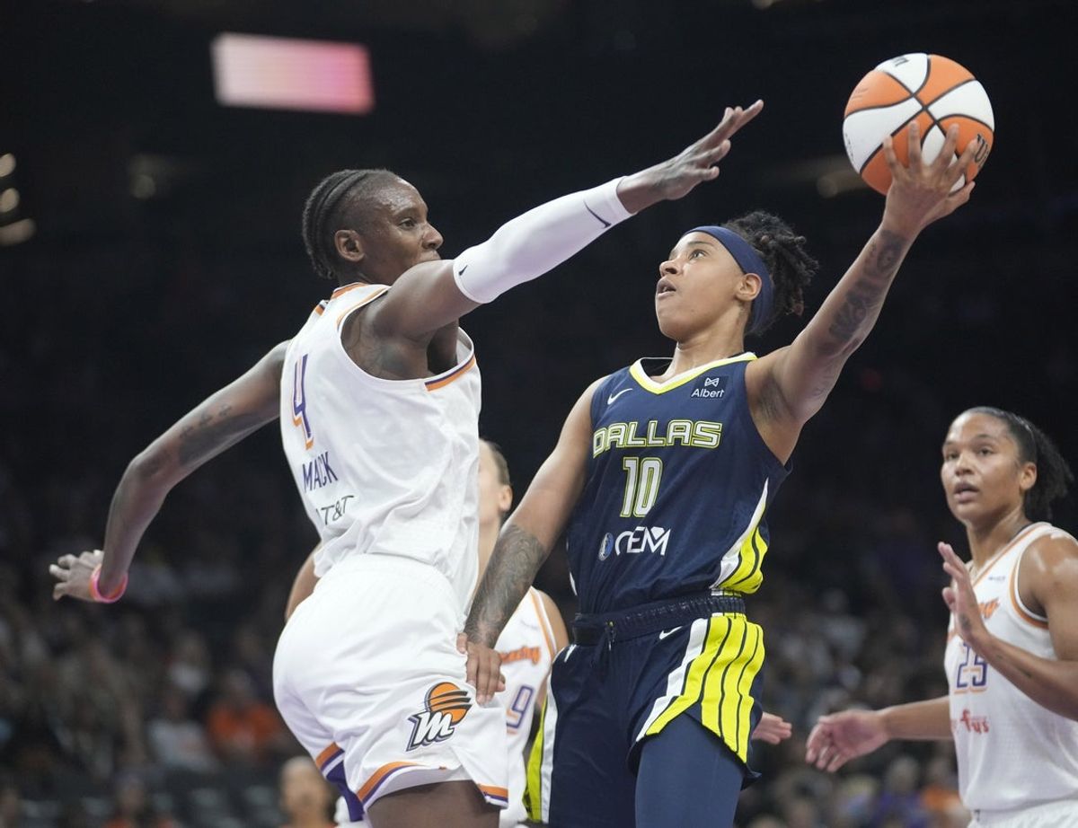 Dallas Wings guard Aziaha James (10) is defended by Phoenix Mercury forward Natasha Mack (4) during the first quarter at PHX Arena on July 7, 2025.