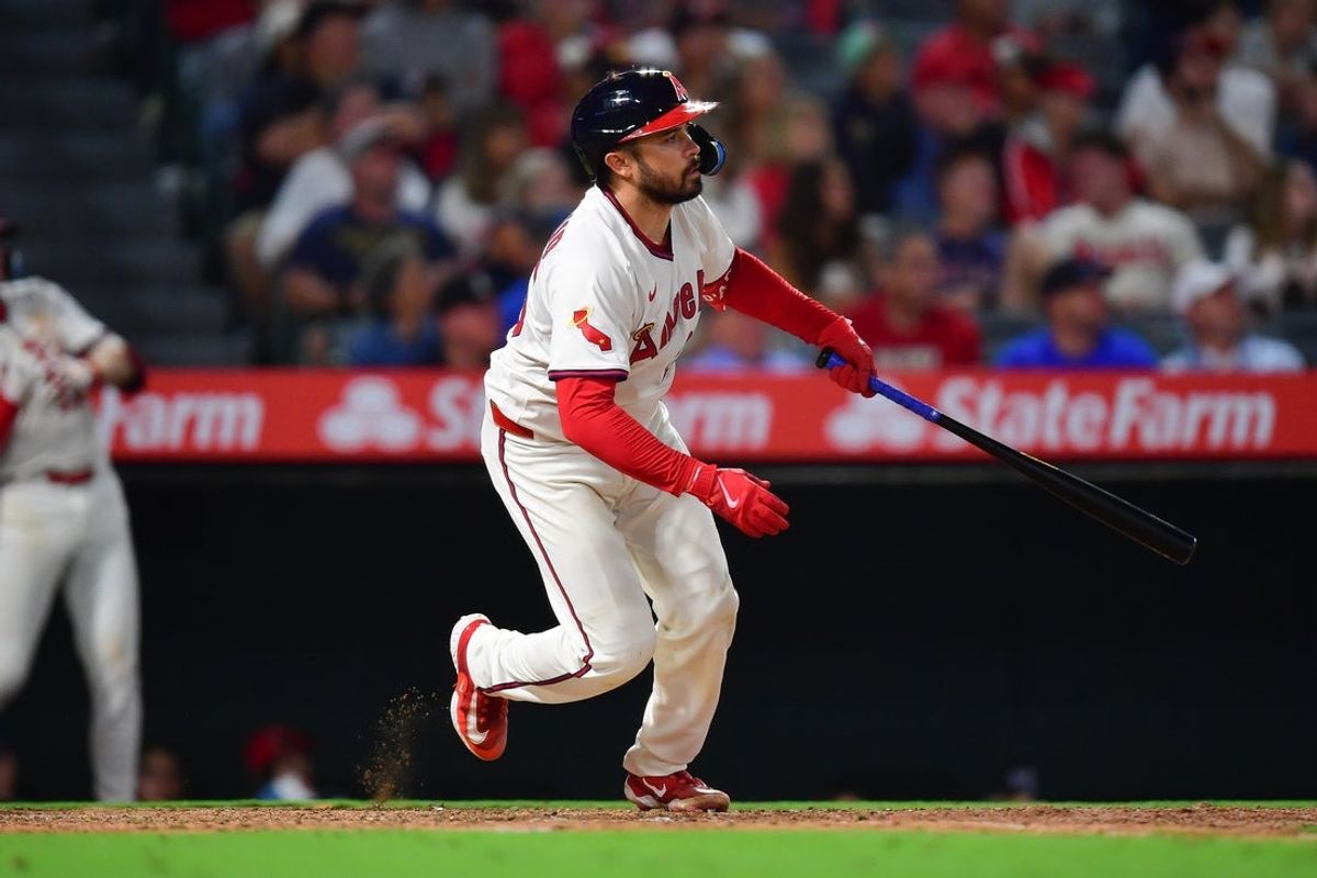 Jul 7, 2025; Anaheim, California, USA; Los Angeles Angels catcher Travis d'Arnaud (25) hits an RBI double against the Texas Rangers during the sixth inning at Angel Stadium. Mandatory Credit: Gary A. Vasquez-Imagn Images