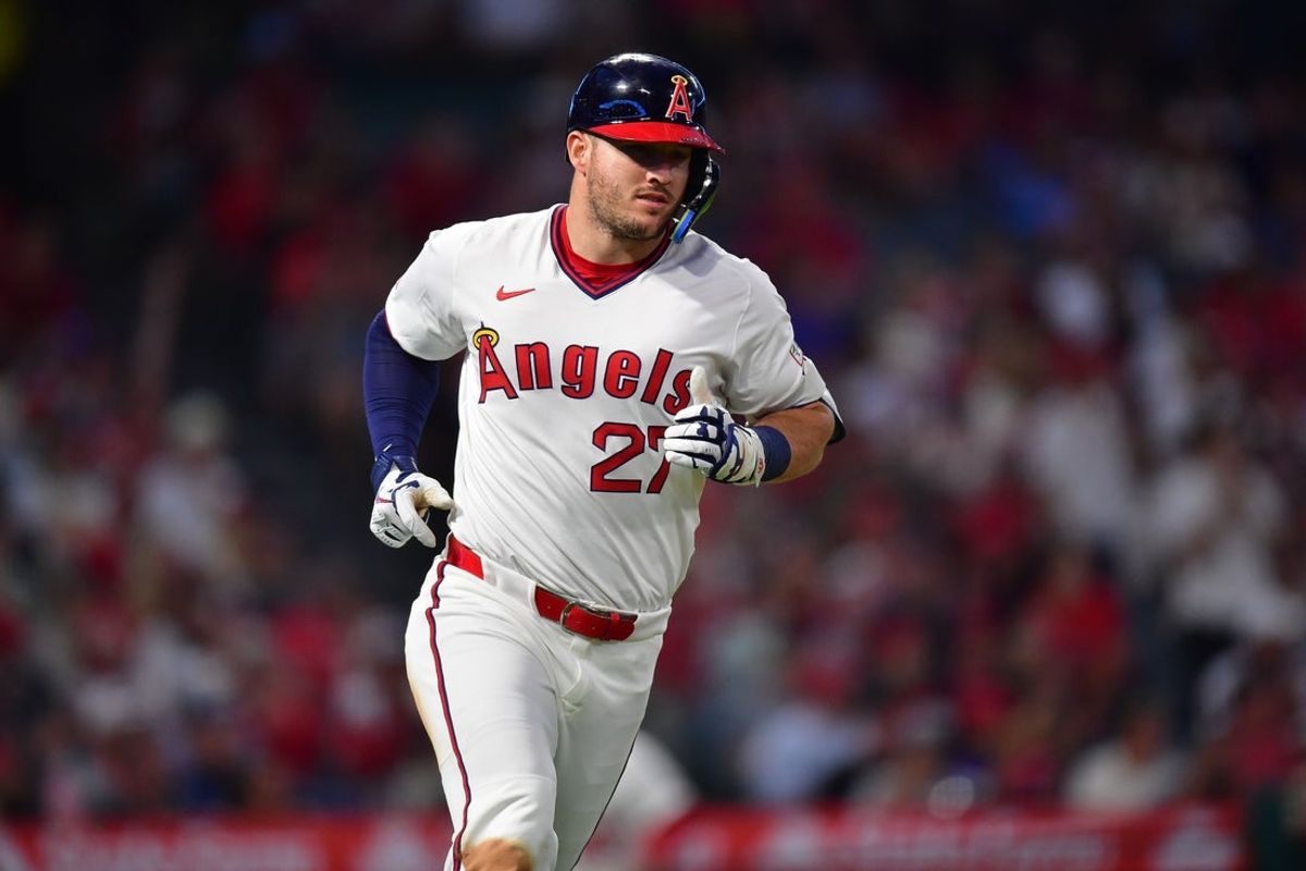 Jul 7, 2025; Anaheim, California, USA; Los Angeles Angels designated hitter Mike Trout (27) runs after hitting a single against the Texas Rangers during the fifth inning at Angel Stadium. Mandatory Credit: Gary A. Vasquez-Imagn Images