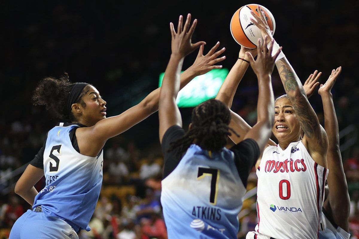 Jul 8, 2025; Fairfax, Virginia, USA; Washington Mystics forward Shakira Austin (0) tries to make a pass past Chicago Sky forward Angel Reese (5) and Chicago Sky guard Ariel Atkins (7) during the first half at EagleBank Arena. Mandatory Credit: Daniel Kucin Jr.-Imagn Images