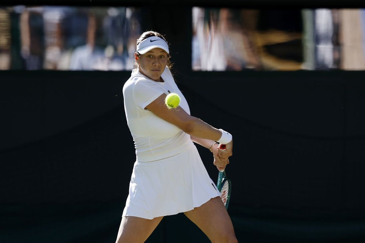 Jul 7, 2025; Wimbledon, United Kingdom; Amanda Anisimova (USA) hits a backhand against Anastasia Pavlyuchenkova(not pictured) in a ladies singles quarter-final on day eight of The Championships Wimbledon 2025 at All England Lawn Tennis and Croquet Club. Mandatory Credit: Geoff Burke-Imagn Images