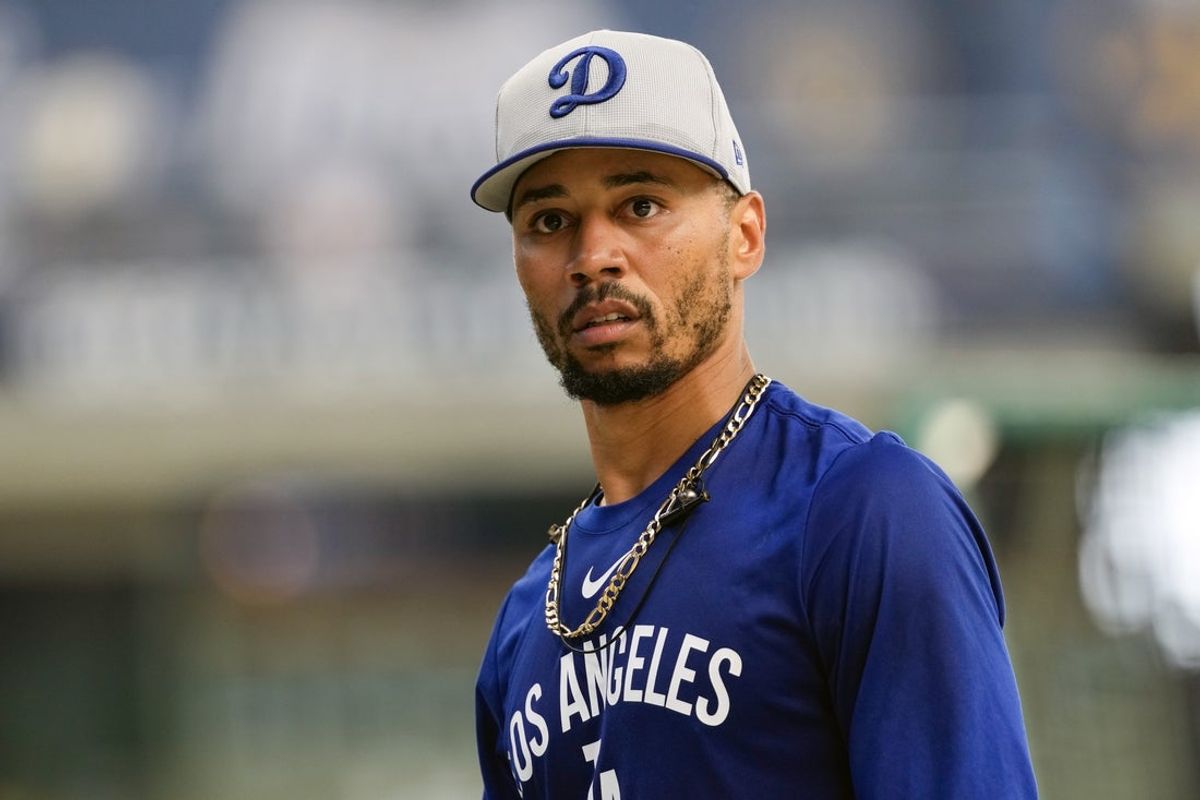 Jul 8, 2025; Milwaukee, Wisconsin, USA;  Los Angeles Dodgers infielder Mookie Betts looks around during batting practice prior to the game against the Los Angeles Dodgers at American Family Field. Mandatory Credit: Jeff Hanisch-Imagn Images