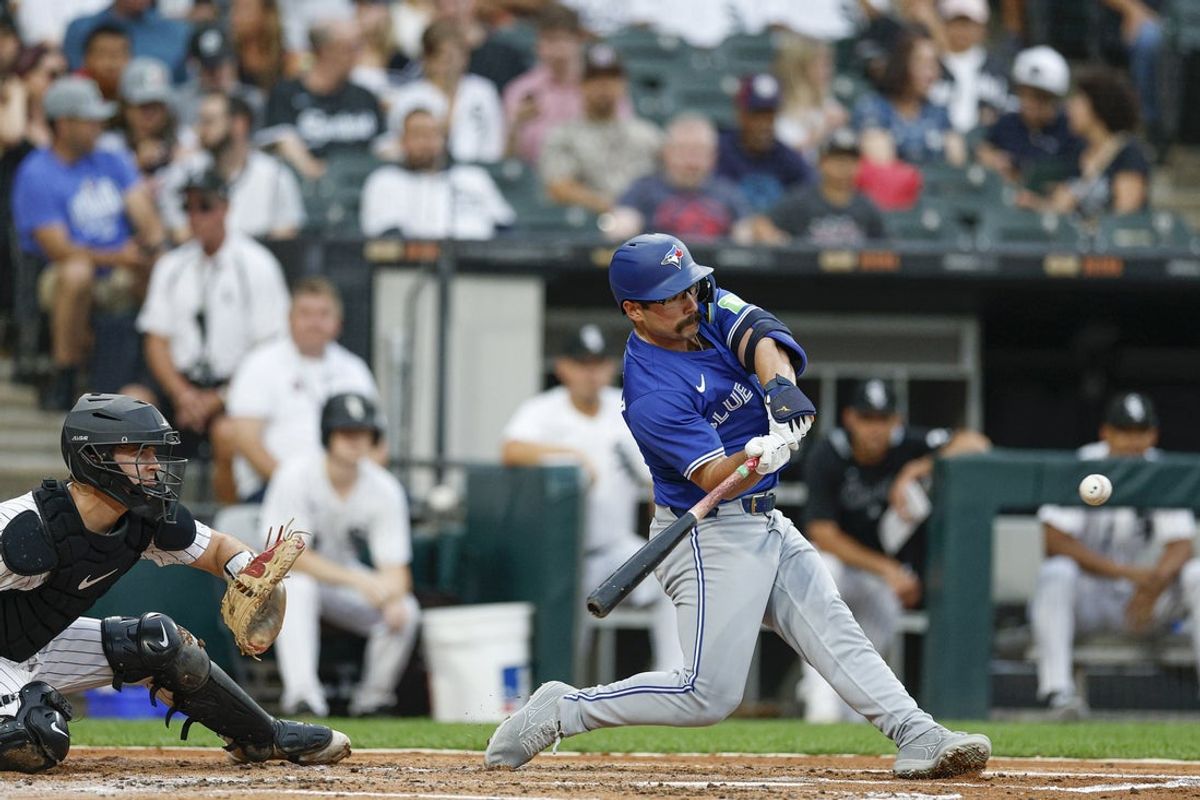 Jul 8, 2025; Chicago, Illinois, USA; Toronto Blue Jays left fielder Davis Schneider (36) hits a solo home run against the Chicago White Sox during the third inning at Rate Field. Mandatory Credit: Kamil Krzaczynski-Imagn Images