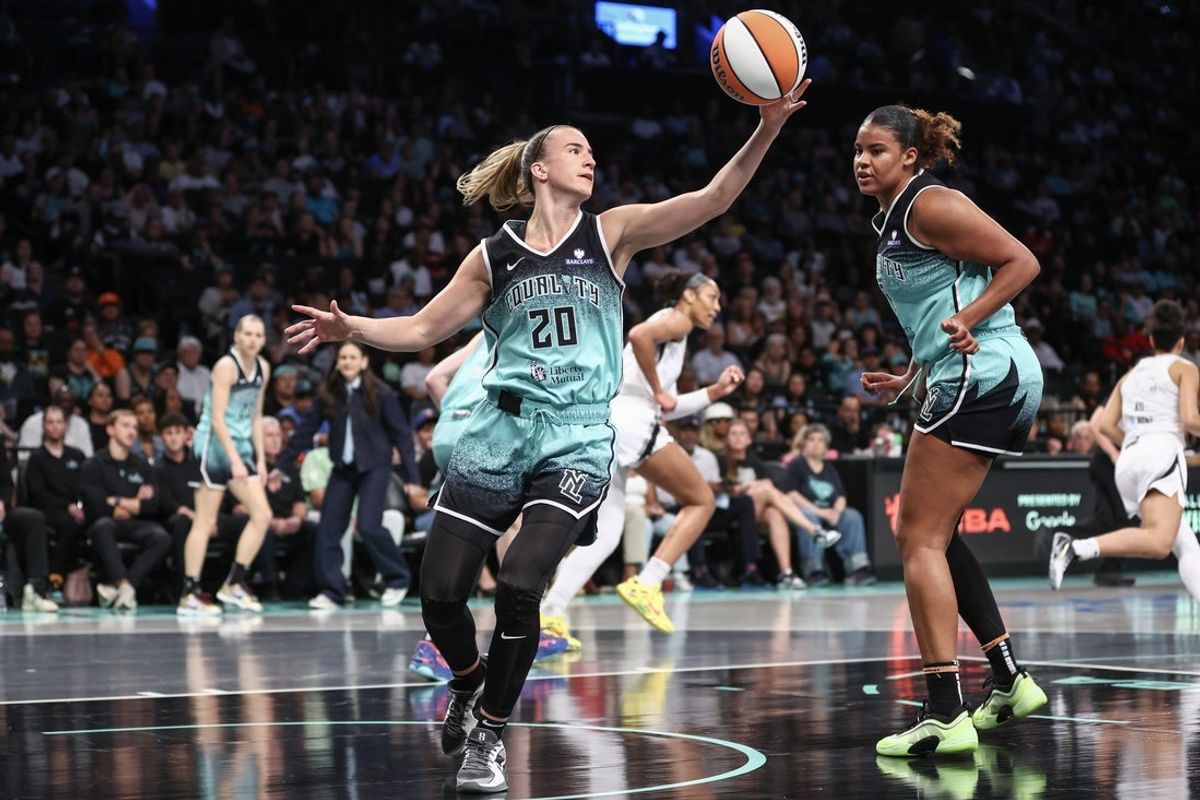 Jul 8, 2025; Brooklyn, New York, USA;  New York Liberty guard Sabrina Ionescu (20) grabs a rebound in the first quarter against the Las Vegas Aces at Barclays Center. Mandatory Credit: Wendell Cruz-Imagn Images