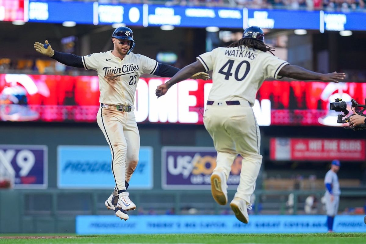 Jul 8, 2025; Minneapolis, Minnesota, USA;  Minnesota Twins designated hitter Ryan Jeffers (27) celebrates his home run with third base coach Tommy Watkins (40) against the Chicago Cubs in the eighth inning at Target Field. Mandatory Credit: Brad Rempel-Imagn Images