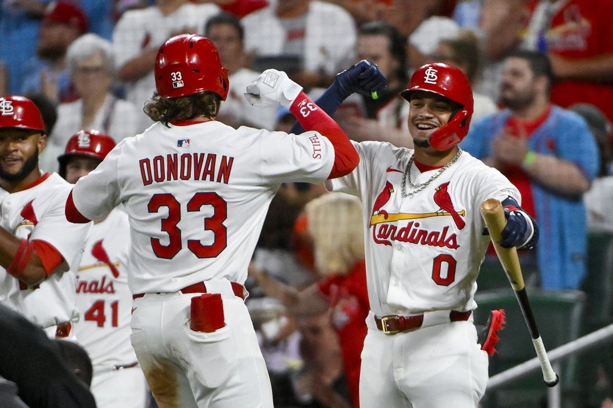 Jul 8, 2025; St. Louis, Missouri, USA;  St. Louis Cardinals left fielder Brendan Donovan (33) celebrates with shortstop Masyn Winn (0) after hitting a two run home run against the Washington Nationals during the third inning at Busch Stadium. Mandatory Credit: Jeff Curry-Imagn Images