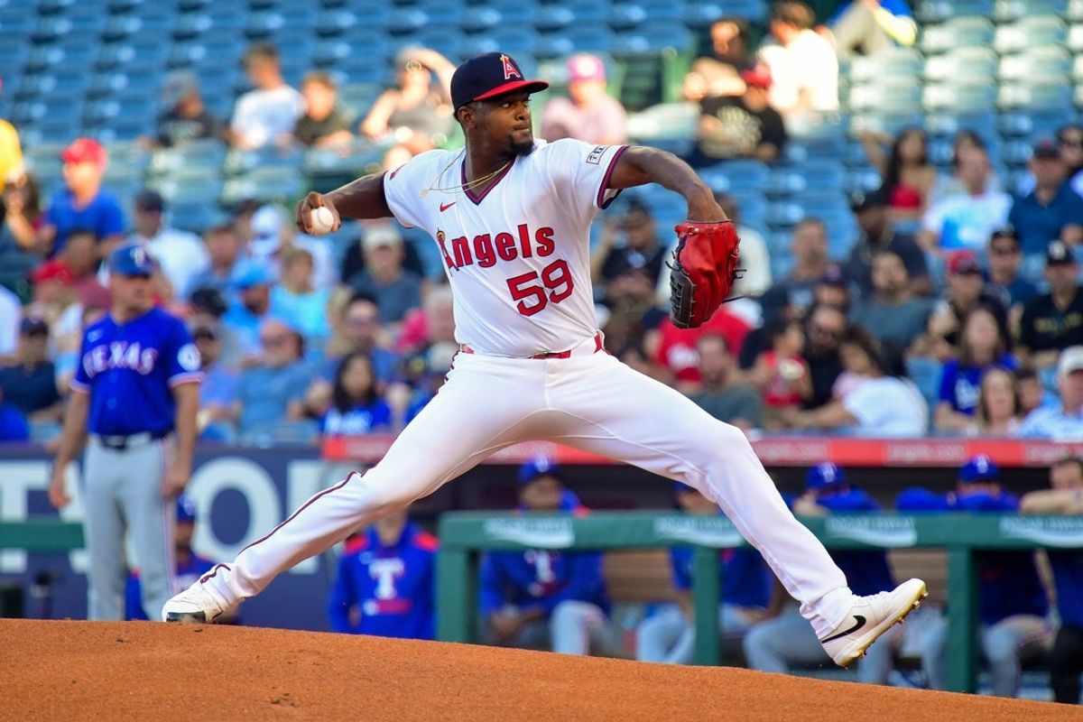 Jul 8, 2025; Anaheim, California, USA; Los Angeles Angels pitcher Jose Soriano (59) throws against the Texas Rangers during the first inning  at Angel Stadium. Mandatory Credit: Gary A. Vasquez-Imagn Images