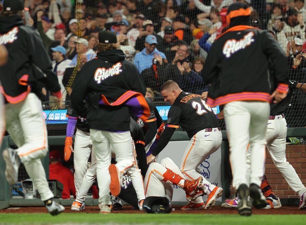 Jul 8, 2025; San Francisco, California, USA; San Francisco Giants teammates surrounds catcher Patrick Bailey (14) after Bailey hit a three-run home run for a walk-off win against the Philadelphia Phillies during the ninth inning at Oracle Park. Mandatory Credit: Kelley L Cox-Imagn Images