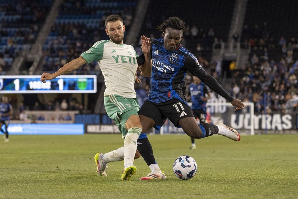 Jul 8, 2025; San Jose, California, USA;  Austin FC defender Brendan Hines-Ike (4) defends against San Jose Earthquakes forward Ousseni Bouda (11) during the second half at PayPal Park. Mandatory Credit: Stan Szeto-Imagn Images