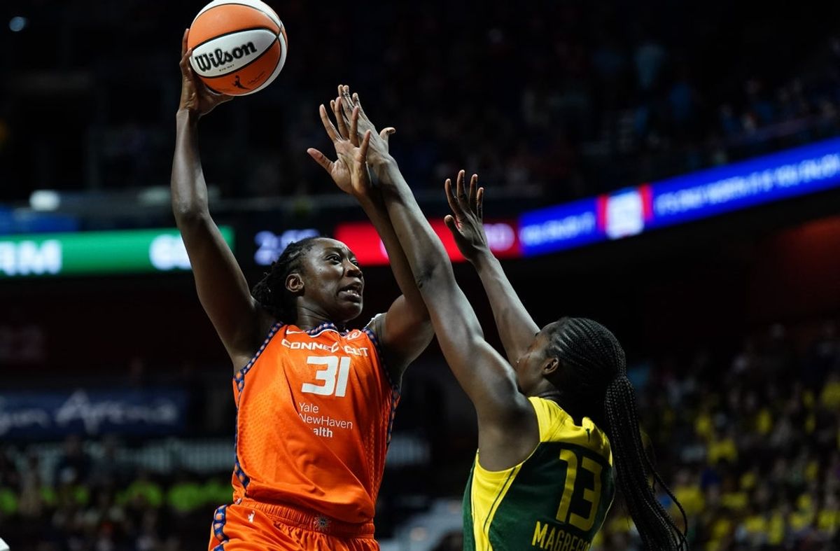 Jul 9, 2025; Uncasville, Connecticut, USA; Connecticut Sun center Tina Charles (31) shoots the ball against Seattle Storm forward Ezi Magbegor (13) in the second half at Mohegan Sun Arena. Mandatory Credit: David Butler II-Imagn Images