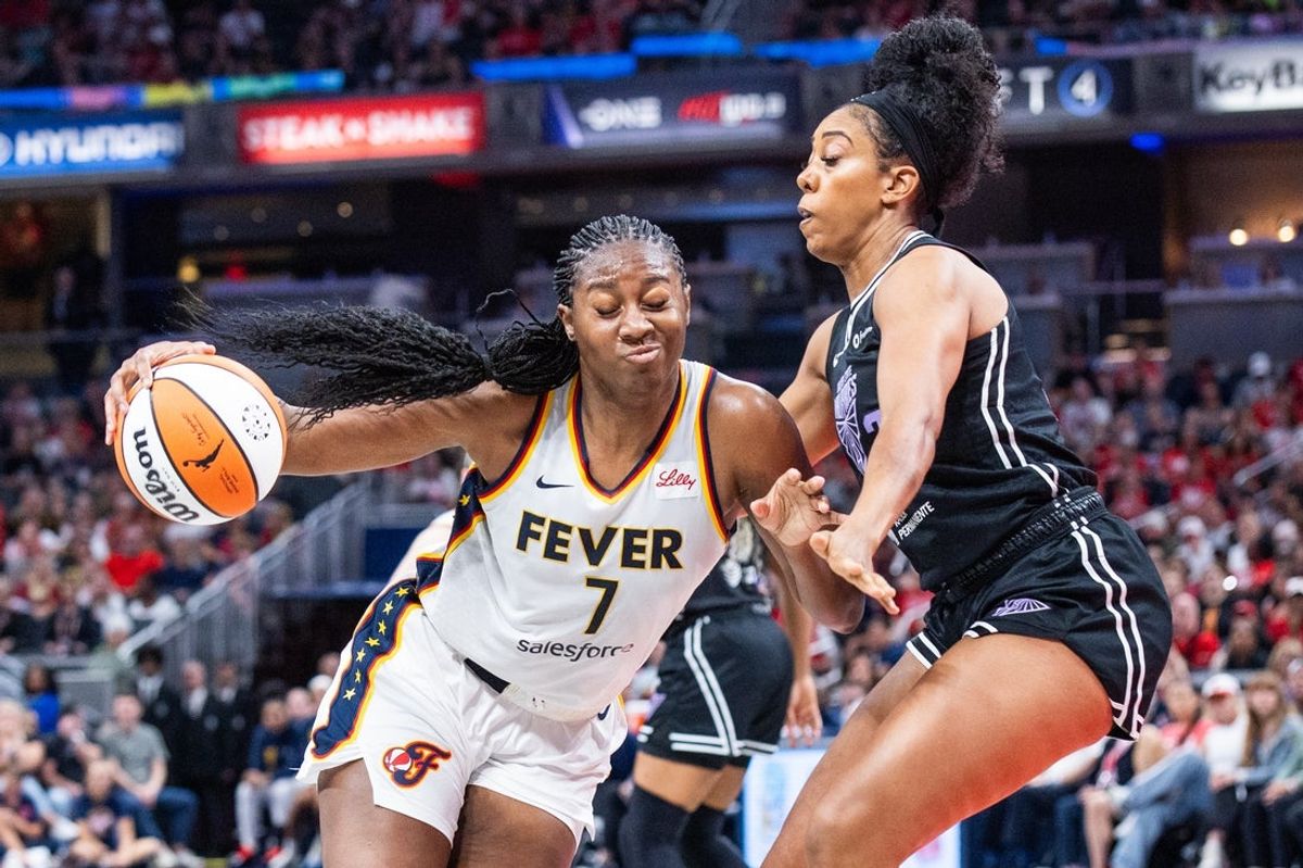 Jul 9, 2025; Indianapolis, Indiana, USA; Indiana Fever forward Aliyah Boston (7) dribbles the ball while Golden State Valkyries forward Monique Billings (25) defends in the first half at Gainbridge Fieldhouse. Mandatory Credit: Trevor Ruszkowski-Imagn Images