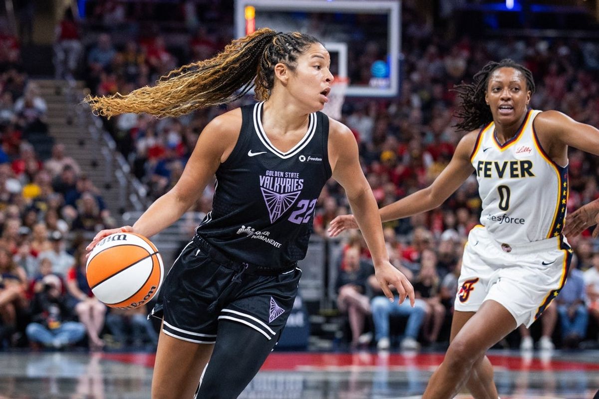 Jul 9, 2025; Indianapolis, Indiana, USA; Golden State Valkyries guard Veronica Burton (22) dribbles  the ball while  Indiana Fever guard Kelsey Mitchell (0)defends in the second half at Gainbridge Fieldhouse. Mandatory Credit: Trevor Ruszkowski-Imagn Images