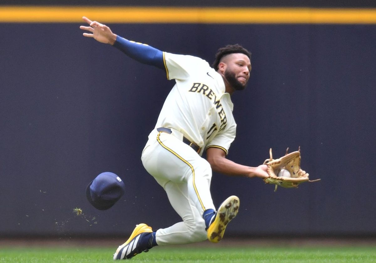 Jul 9, 2025; Milwaukee, Wisconsin, USA; Milwaukee Brewers center fielder Jackson Chourio (11) catches Los Angeles Dodgers designated hitter Shohei Ohtani (not pictured) fly ball during the third inning at American Family Field. Mandatory Credit: Patrick Gorski-Imagn Images