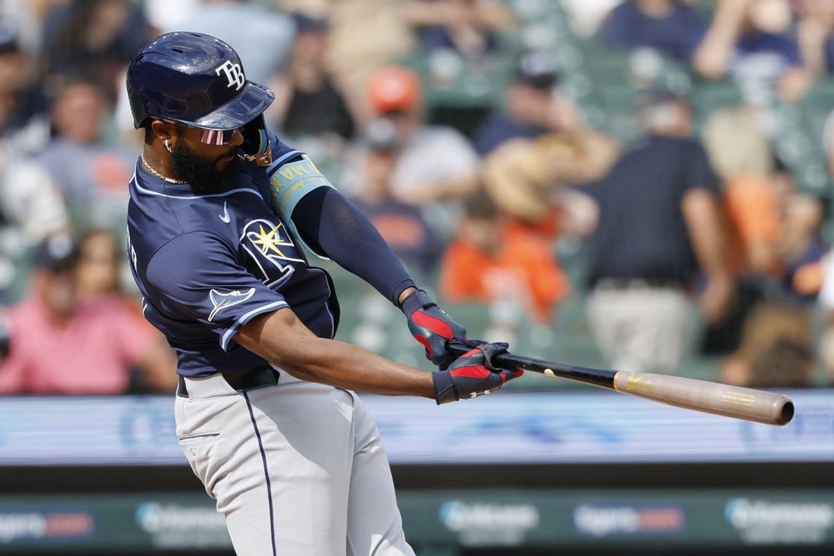 Jul 9, 2025; Detroit, Michigan, USA;  Tampa Bay Rays third baseman Junior Caminero (13) hits a single in the first inning against the Detroit Tigers at Comerica Park. Mandatory Credit: Rick Osentoski-Imagn Images
