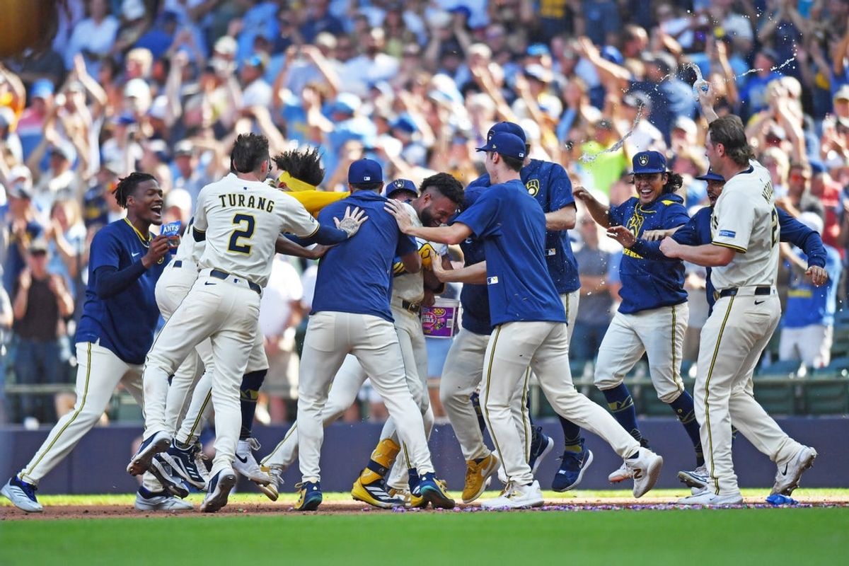 Jul 9, 2025; Milwaukee, Wisconsin, USA; The Milwaukee Brewers celebrate a walk-off single by center fielder Jackson Chourio during the tenth inning against the Los Angeles Dodgers at American Family Field. Mandatory Credit: Patrick Gorski-Imagn Images