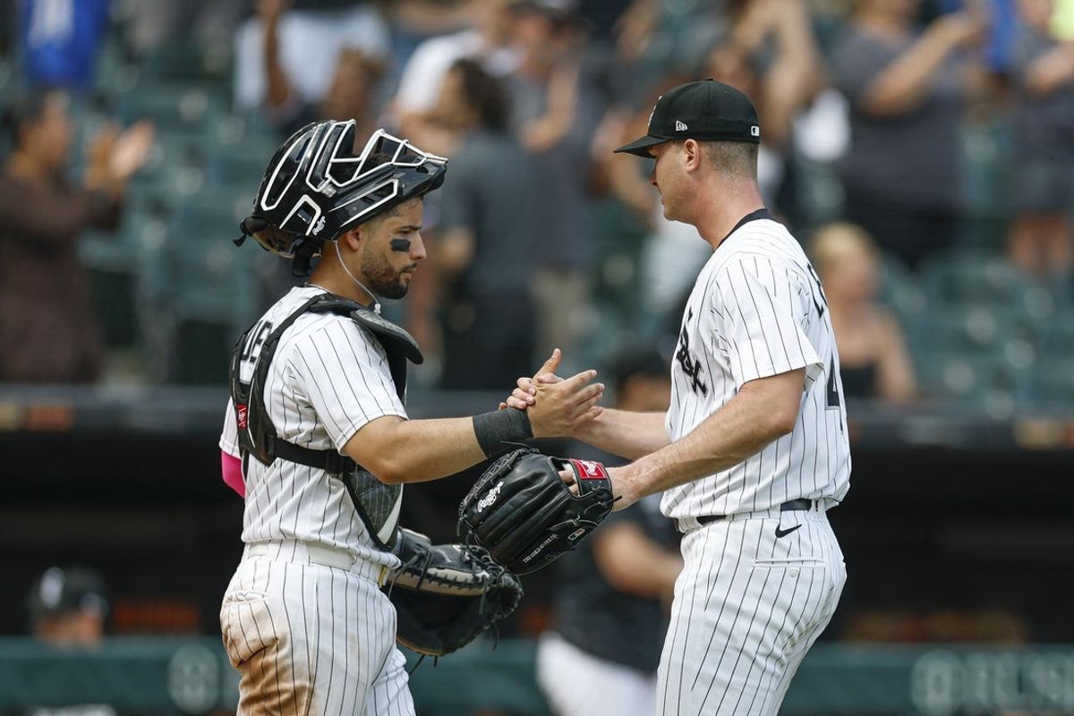 Jul 9, 2025; Chicago, Illinois, USA; Chicago White Sox pitcher Jordan Leasure (R) celebrates with catcher Edgar Quero (L) team's win against the Toronto Blue Jays at Rate Field. Mandatory Credit: Kamil Krzaczynski-Imagn Images
