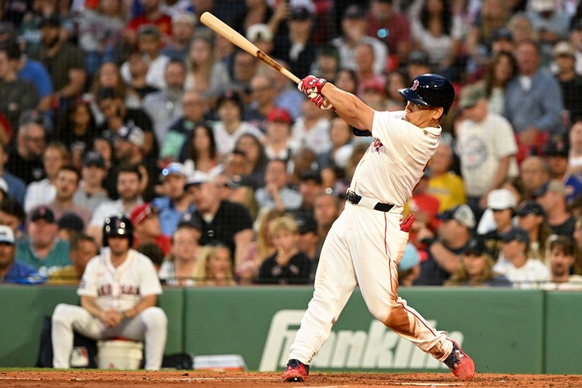 Jul 9, 2025; Boston, Massachusetts, USA;  Boston Red Sox designated hitter Masataka Yoshida (7) hits a RBI single against the Colorado Rockies during the fourth inning at Fenway Park. Mandatory Credit: Brian Fluharty-Imagn Images