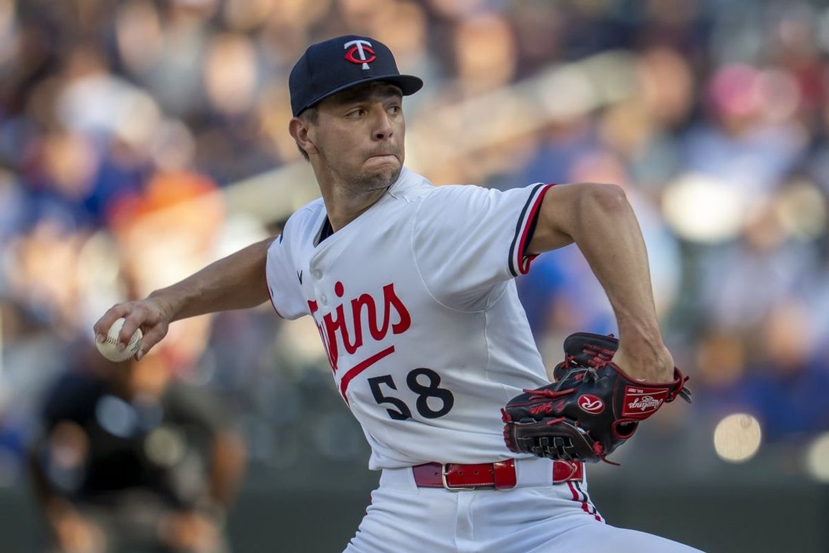 Jul 9, 2025; Minneapolis, Minnesota, USA; Minnesota Twins starting pitcher David Festa (58) delivers a pitch against the Chicago Cubs in the first inning at Target Field. Mandatory Credit: Jesse Johnson-Imagn Images