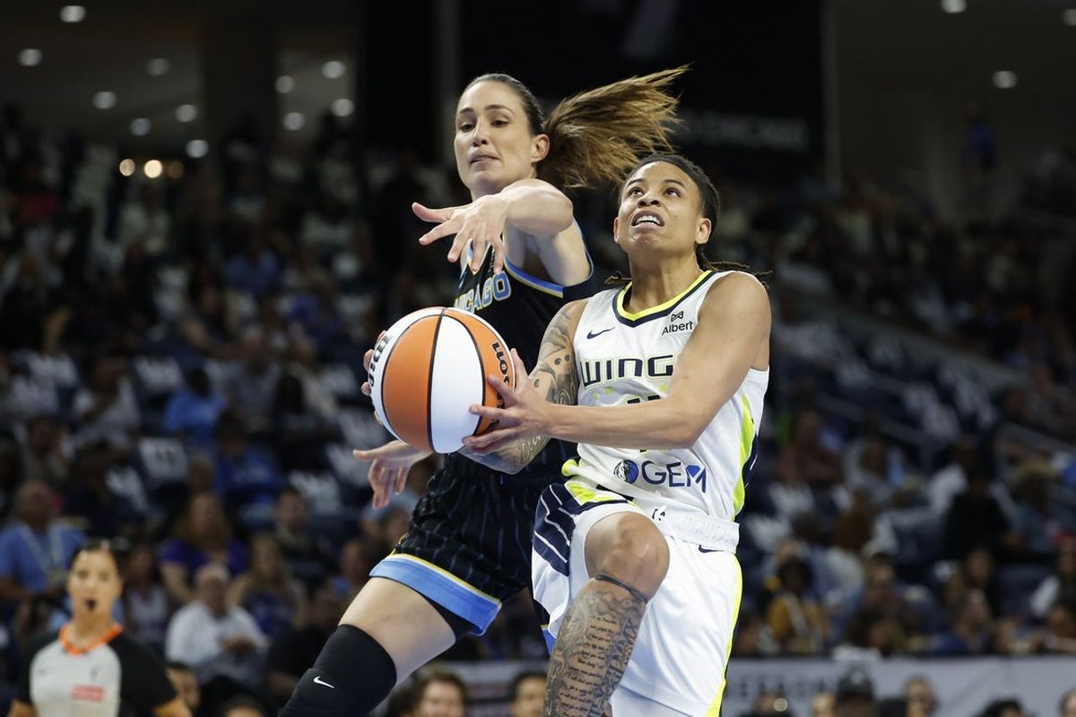 Jul 9, 2025; Chicago, Illinois, USA; Chicago Sky guard Rebecca Allen (9) fouls Dallas Wings guard JJ Quinerly (11) during the first half at Wintrust Arena. Mandatory Credit: Kamil Krzaczynski-Imagn Images